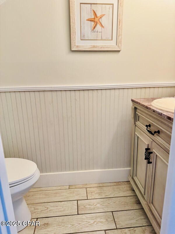 bathroom featuring vanity and toilet