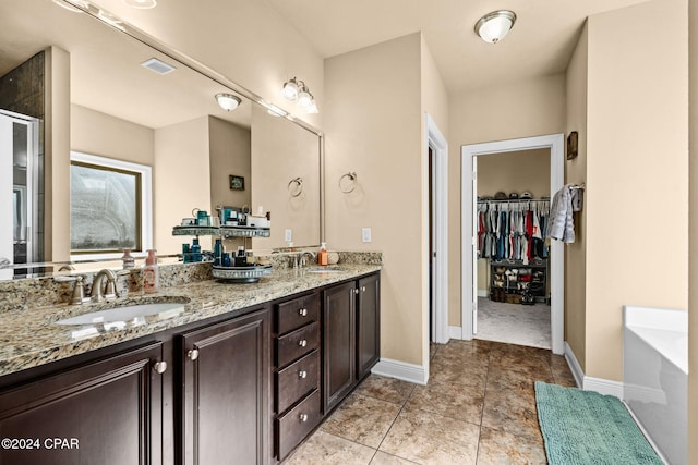 bathroom with tile patterned floors, separate shower and tub, and vanity