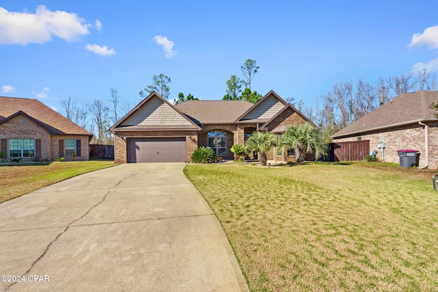 view of front of house featuring a front lawn and a garage