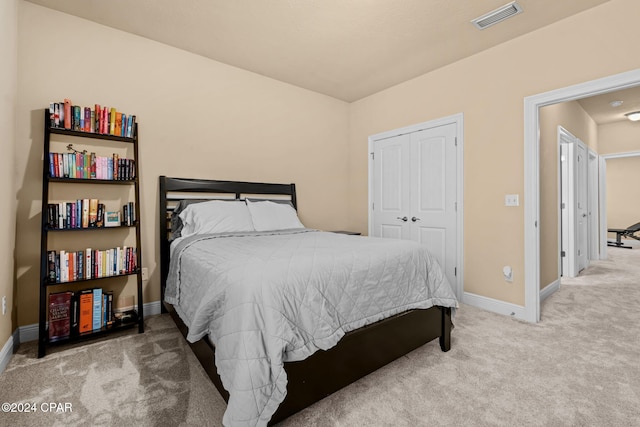 carpeted bedroom with a closet