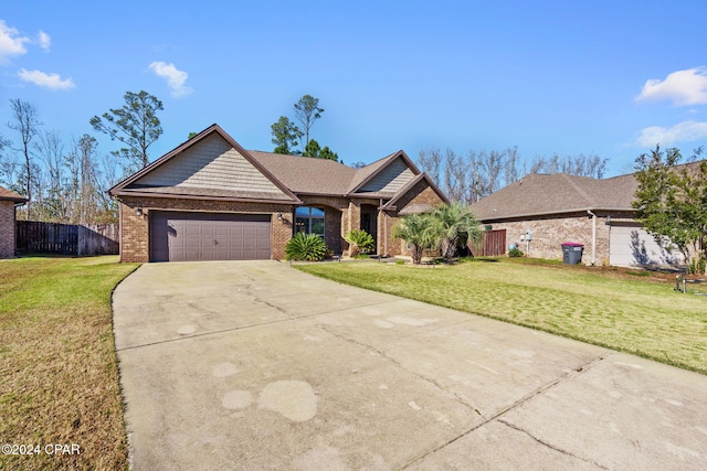 single story home with a front yard and a garage