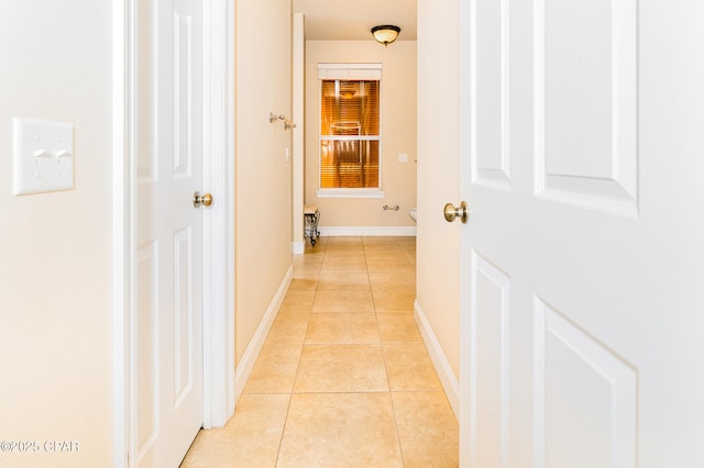 hallway featuring light tile patterned flooring