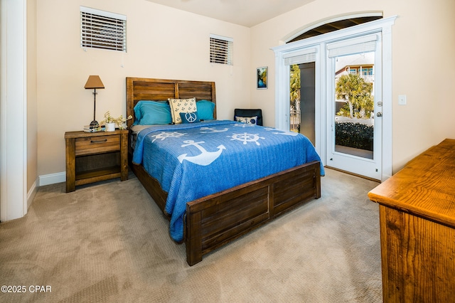 carpeted bedroom featuring access to exterior