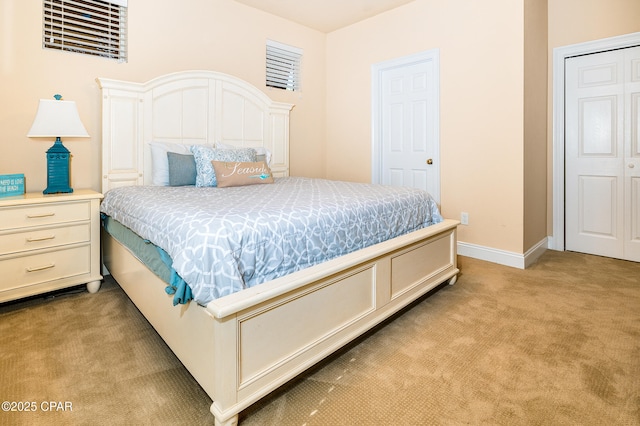 carpeted bedroom featuring a closet