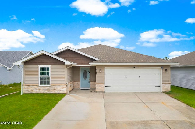 view of front of house with a front lawn and a garage