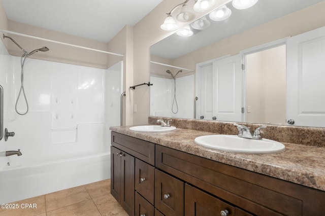 bathroom with tile patterned flooring, vanity, and shower / bathtub combination