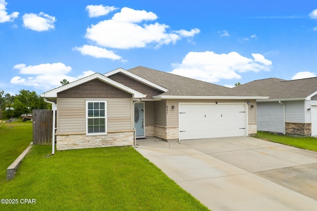 view of front of property with a garage and a front lawn