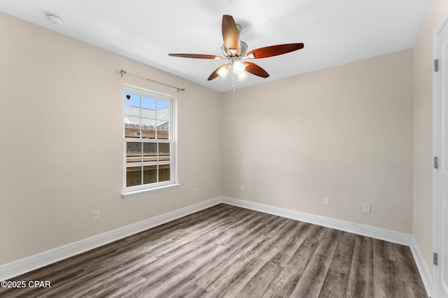 empty room with hardwood / wood-style flooring and ceiling fan