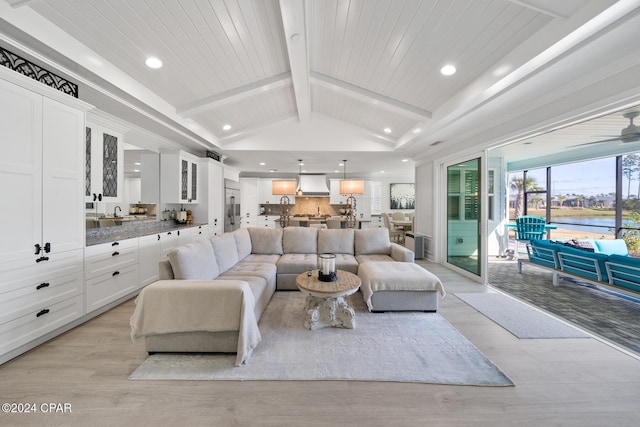 living room featuring vaulted ceiling with beams, light hardwood / wood-style floors, and wood ceiling