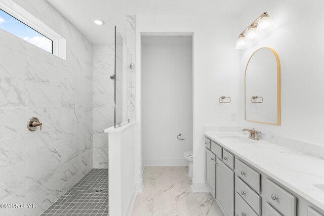 bathroom featuring ceiling fan and vanity