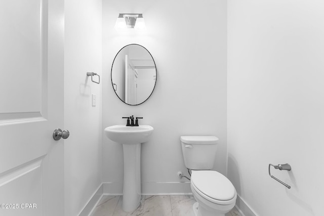 bathroom featuring toilet and sink