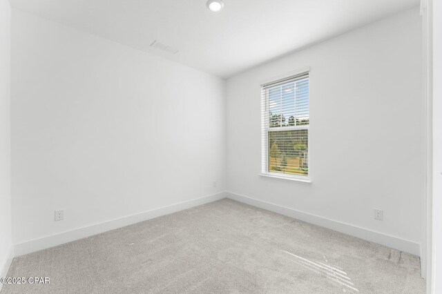 spare room with carpet floors