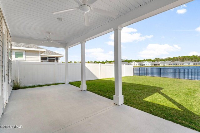 rear view of house with a lawn and a patio