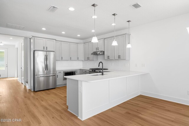 unfurnished room with ceiling fan and light hardwood / wood-style floors