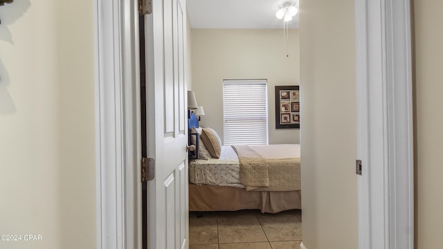 bedroom with light tile patterned floors