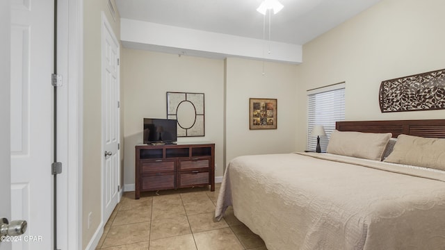 bedroom featuring light tile patterned flooring