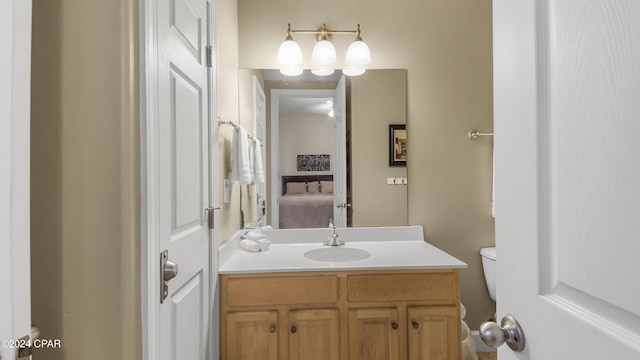 bathroom with vanity and toilet