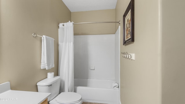 full bathroom featuring shower / bath combo, vanity, and toilet