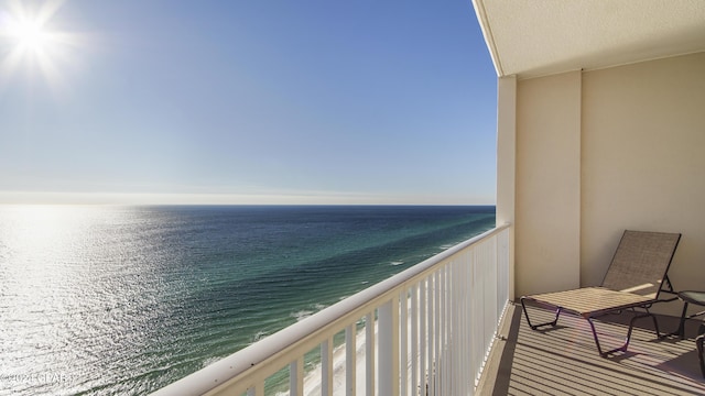 balcony featuring a water view