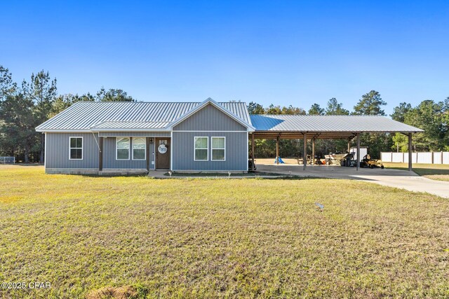 single story home featuring a front lawn and a carport