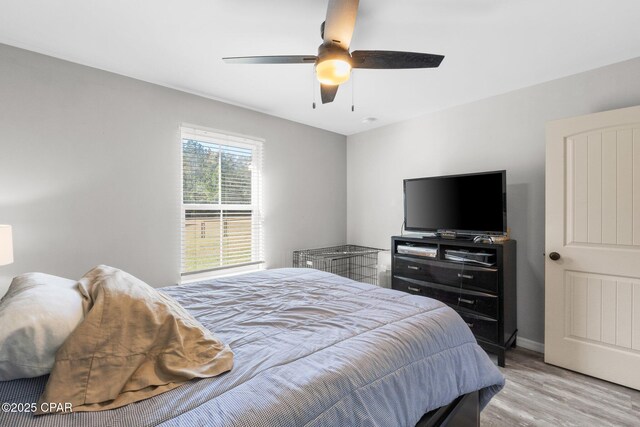 bedroom featuring ceiling fan and light hardwood / wood-style floors