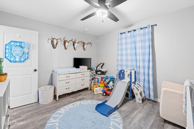 bedroom featuring ceiling fan and light hardwood / wood-style flooring