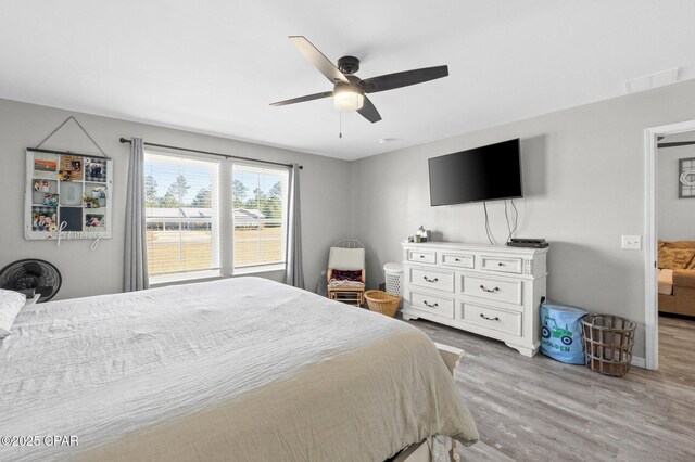 bedroom featuring light wood-type flooring and ceiling fan