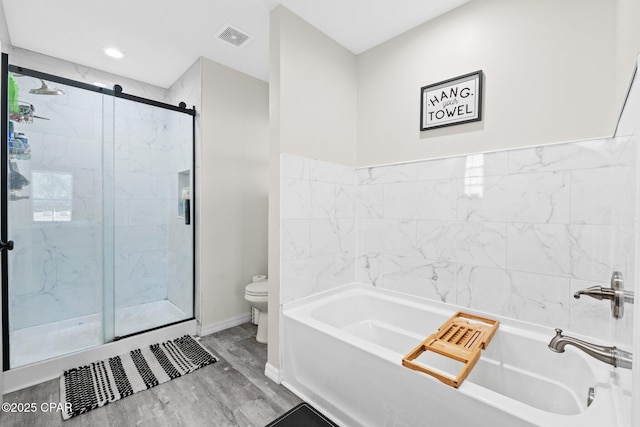 bathroom with independent shower and bath, wood-type flooring, and toilet