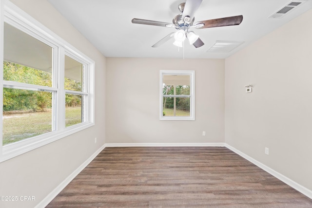 empty room with ceiling fan and hardwood / wood-style floors