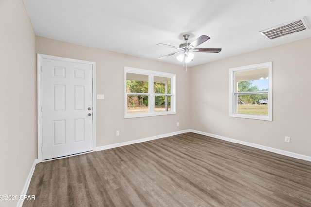 unfurnished room with ceiling fan and wood-type flooring