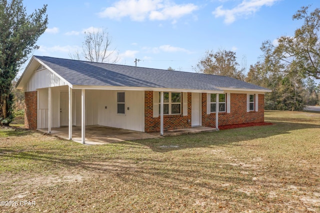 single story home featuring a front yard and a carport