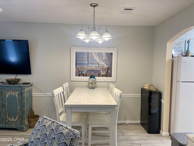 dining room featuring a chandelier