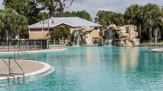 view of pool featuring pool water feature