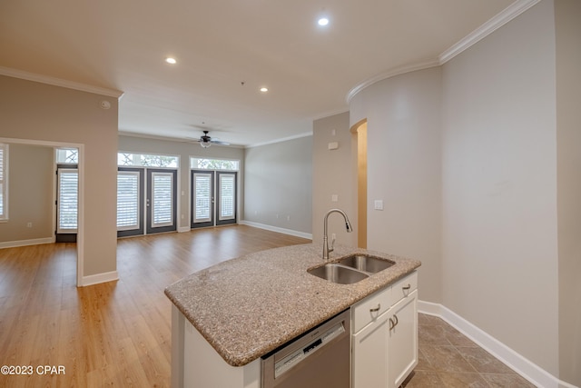 8700 Front Beach Rd Unit 5302, Panama City Beach, FL 32407 - kitchen featuring a center island with sink, stainless steel dishwasher, ornamental molding, and a sink