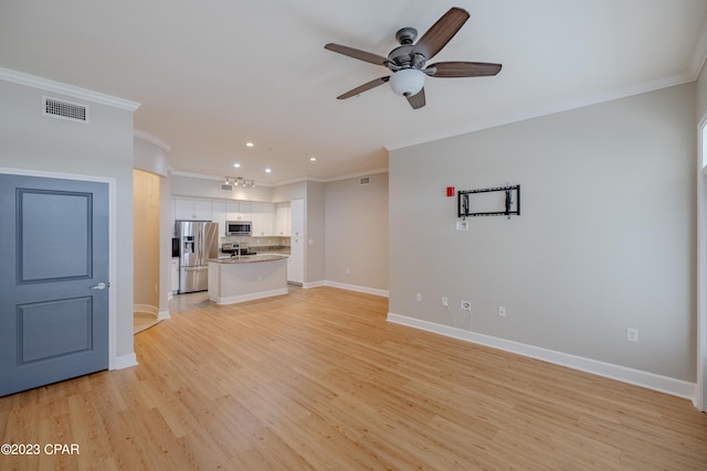 unfurnished living room featuring light hardwood / wood-style floors, ceiling fan, and crown molding