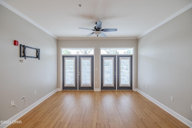 spare room with crown molding, french doors, ceiling fan, and light hardwood / wood-style floors