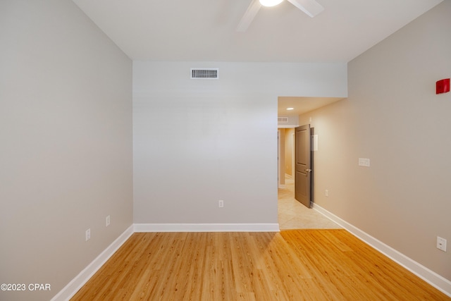 unfurnished room with ceiling fan and light hardwood / wood-style flooring