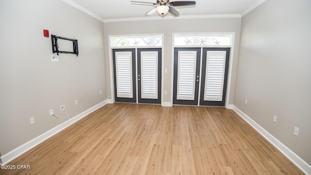 spare room featuring french doors, light hardwood / wood-style floors, ceiling fan, and ornamental molding