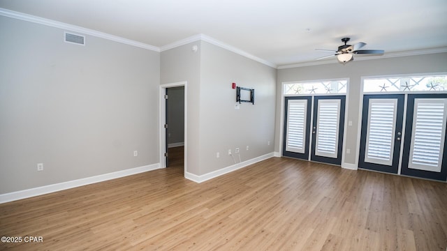 unfurnished room featuring ceiling fan, french doors, light hardwood / wood-style floors, and ornamental molding