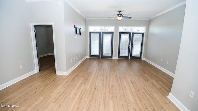 spare room featuring french doors, light hardwood / wood-style flooring, ceiling fan, and ornamental molding