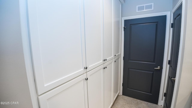 interior space with light tile patterned floors