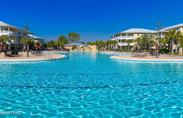 view of swimming pool featuring a patio area