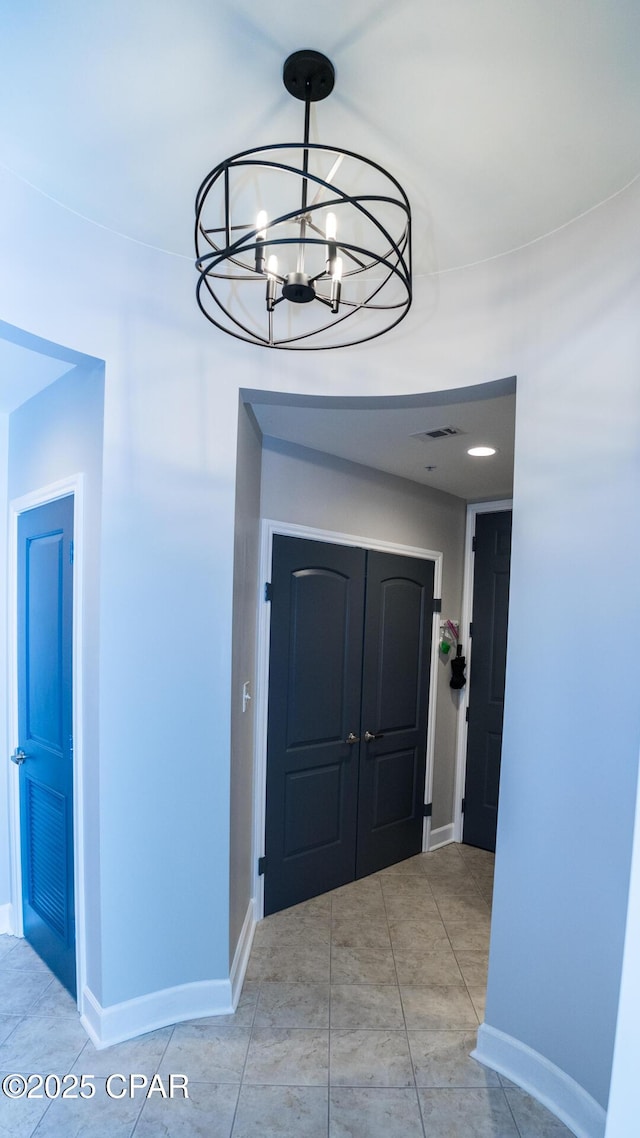 8700 Front Beach Rd Unit 5302, Panama City Beach, FL 32407 - foyer entrance featuring visible vents, baseboards, and an inviting chandelier