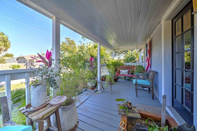 wooden terrace featuring a porch