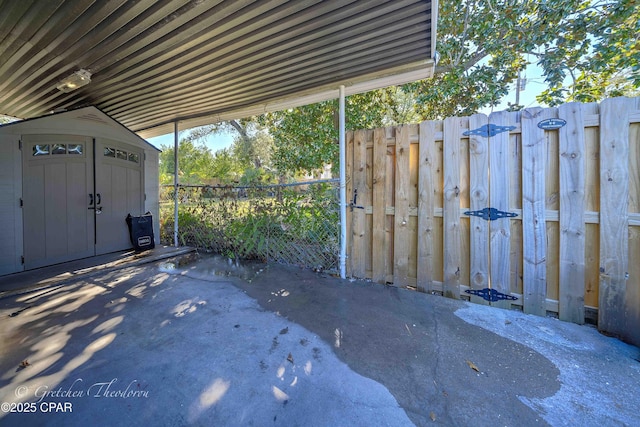 view of patio / terrace featuring a storage shed