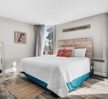 bedroom featuring wood-type flooring