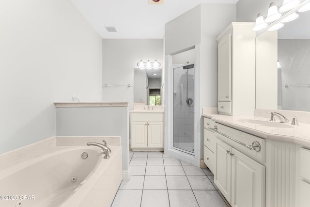 bathroom featuring tile patterned flooring, vanity, and separate shower and tub