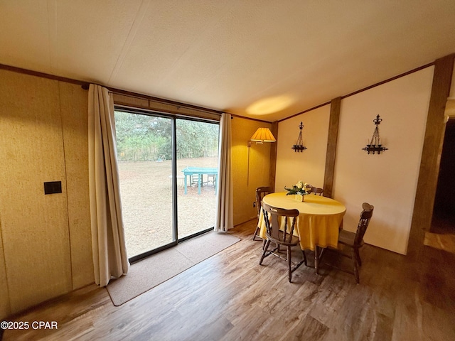 dining space with hardwood / wood-style floors