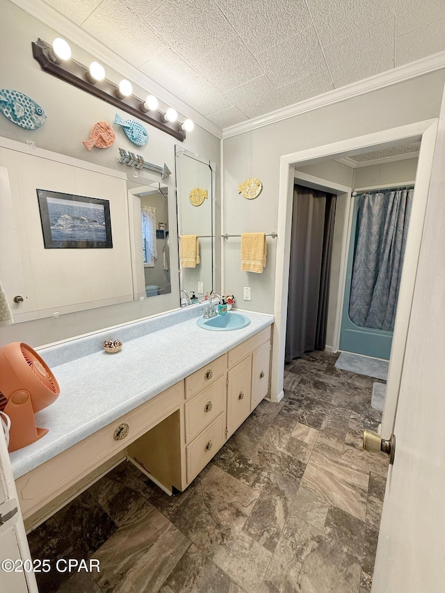 bathroom featuring vanity and ornamental molding