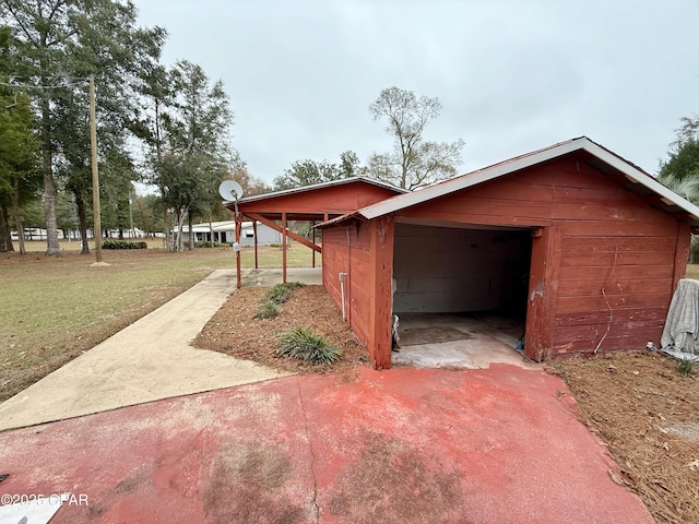 view of home's exterior with a lawn and a garage